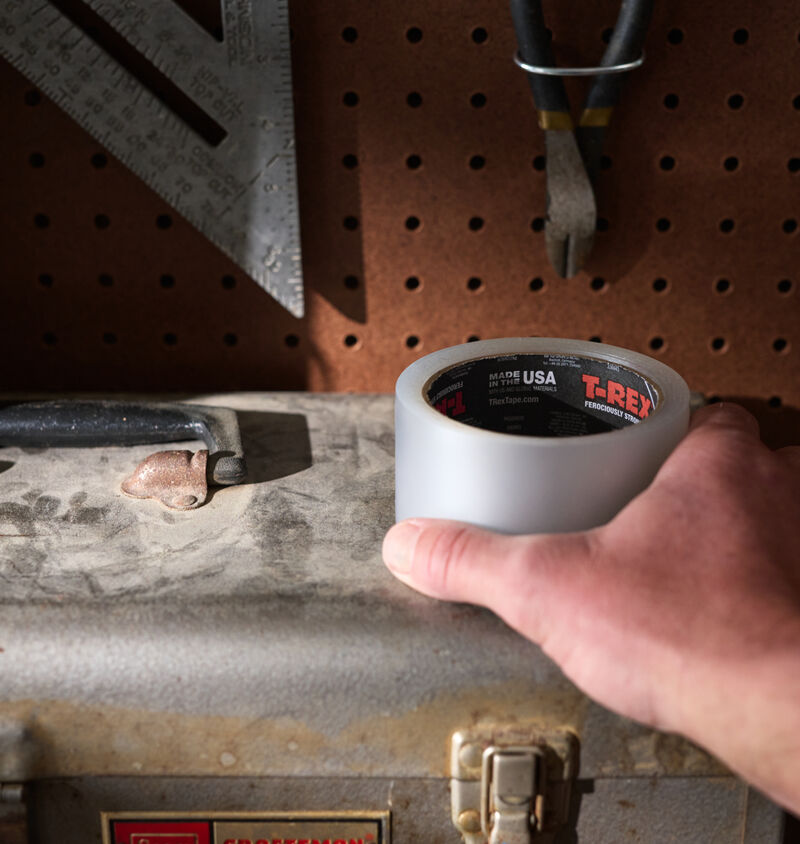 A roll of T-Rex Clear Waterproof Tape on a toolbox