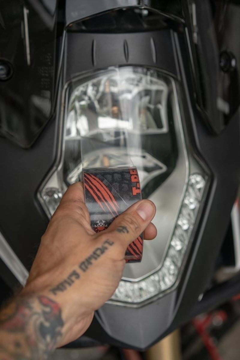 Use clear repair to cover a motorcycle headlight