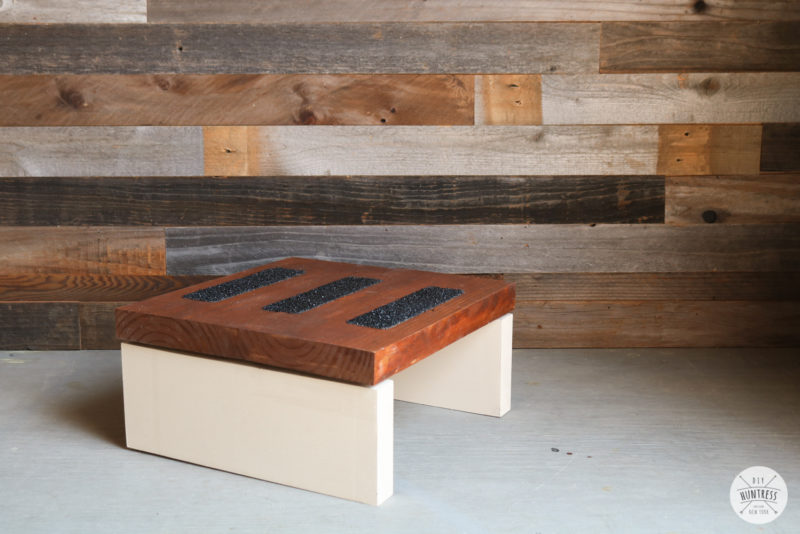 Folding step stool with tread tape on the step